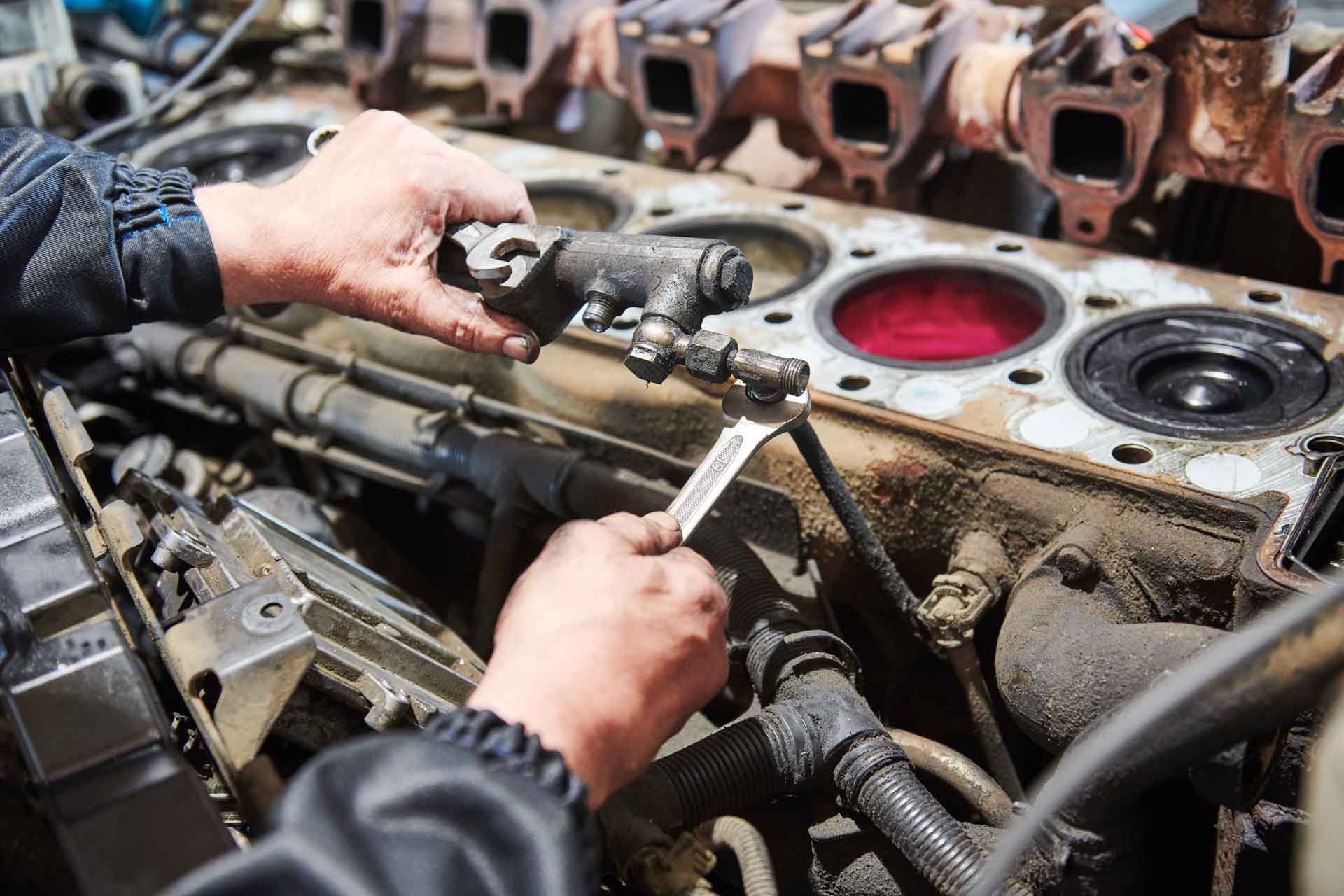 Mechanic working on a diesel engine